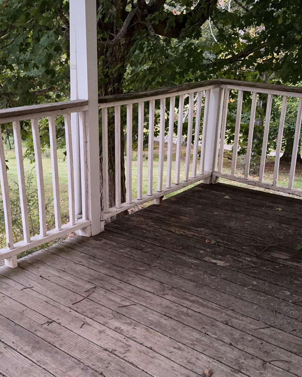 The crew’s photo of the porch corner, as shot, before anyone measured it.